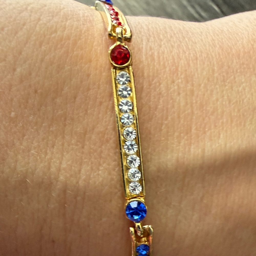 Elegant Gold Bracelet with Red, Blue, and White Accents - Picture 5 of 8